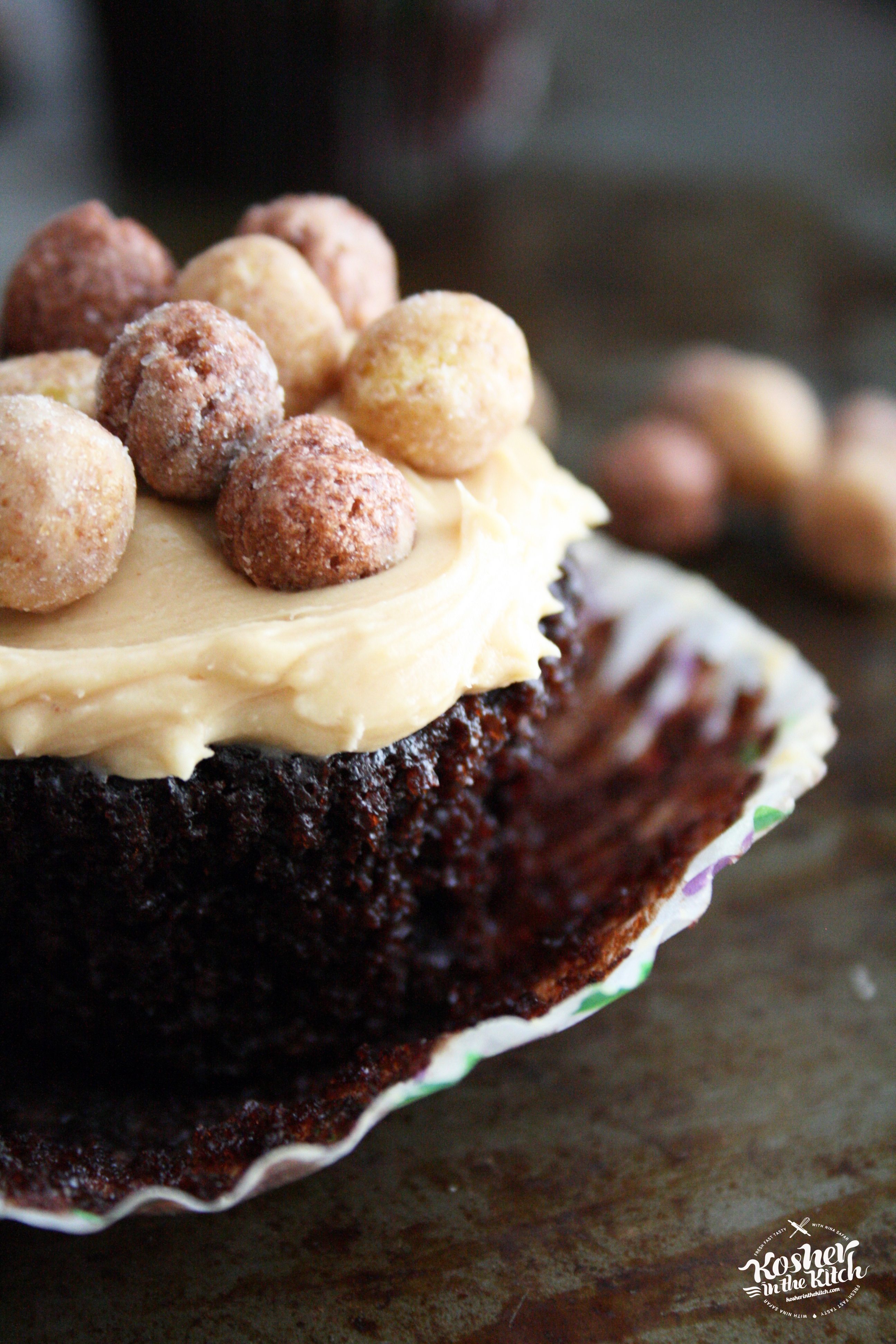 Chocolate Cupcake with Peanut Butter Frosting topped with Reese's Puffs Cereal
