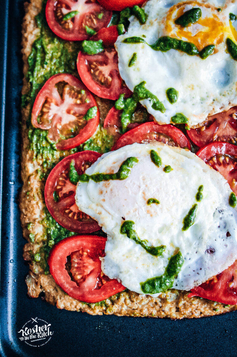 Cauliflower Crust Pizza with Tomatoes, Pesto & Eggs - Kosher In The Kitch!