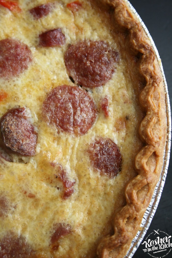 savory sausage pie with peppers and onions