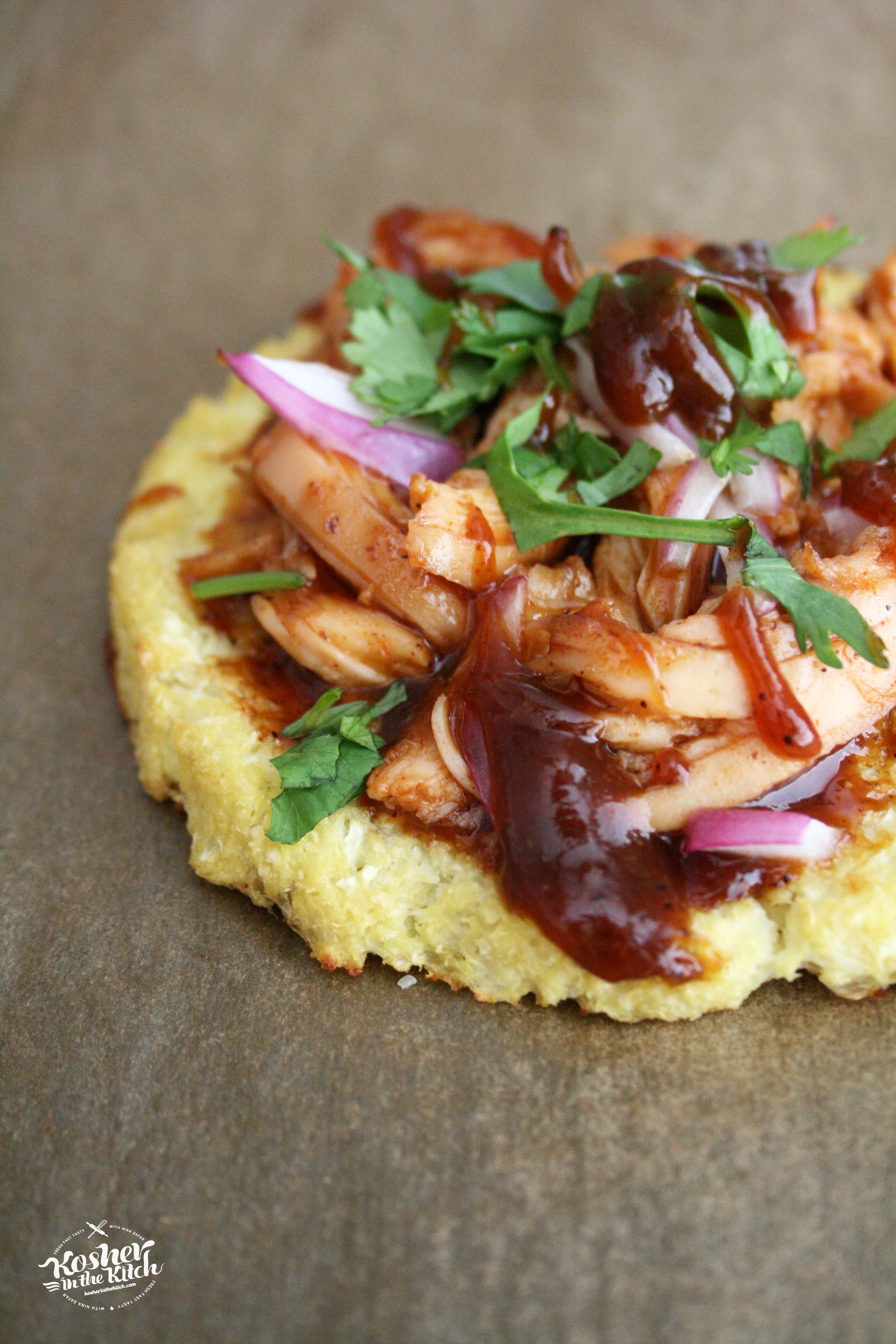 Cook cauliflower pizza with toppings then top with additional bbq sauce