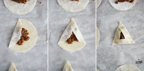 Wet all corners with water then fold left side over, then right side and last bring bottom over sealing the triangle.