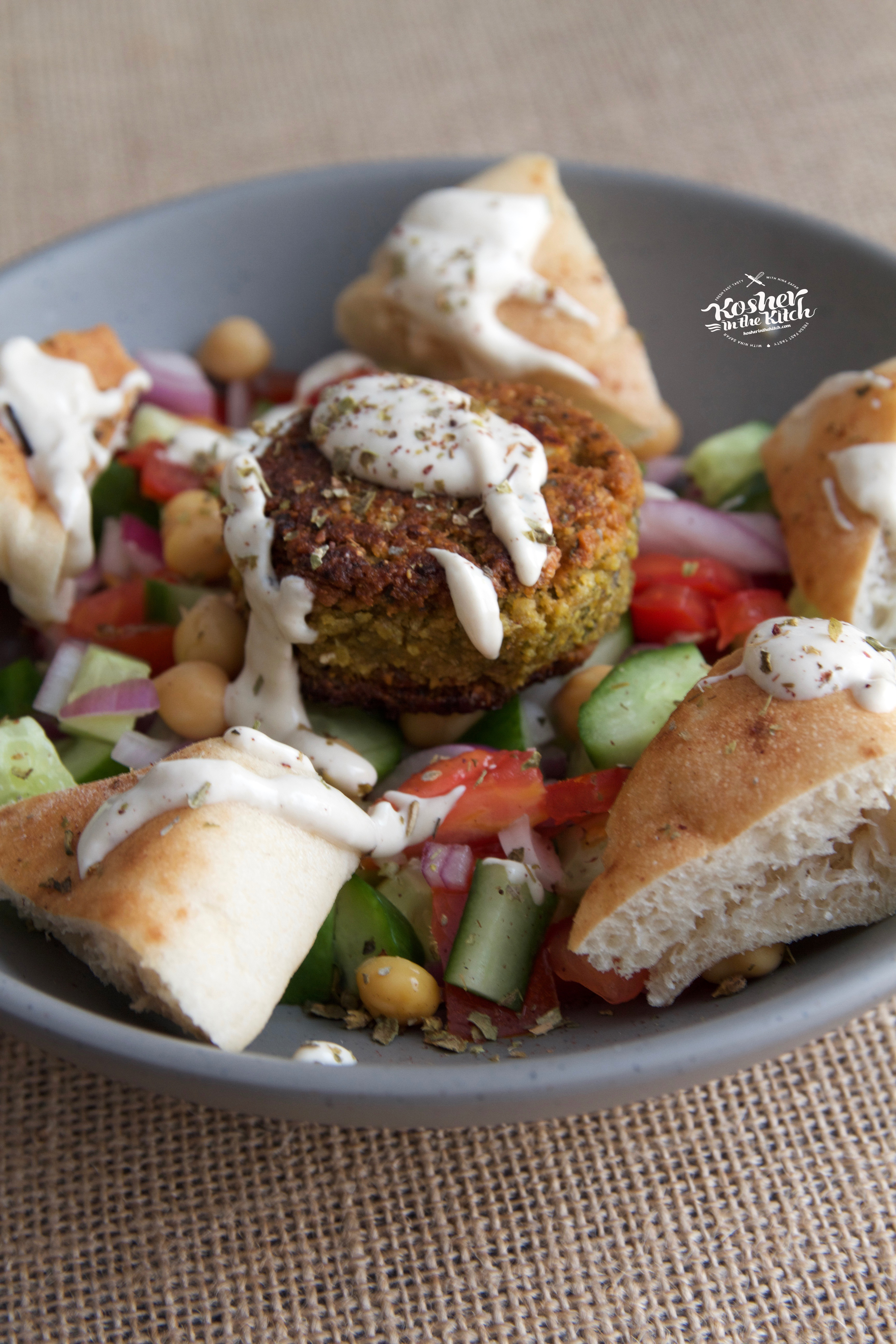 Stuffed Falafel Balls served over Israeli Salad with Pita Chips