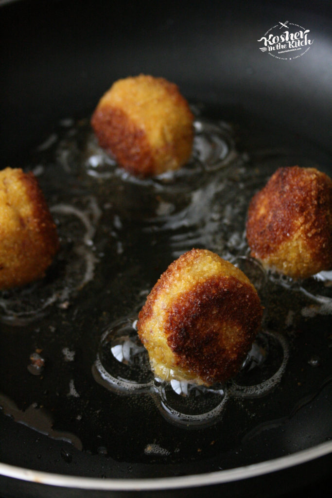 Dip in eggs, coat in corn flake crumbs then fry until golden brown on all sides