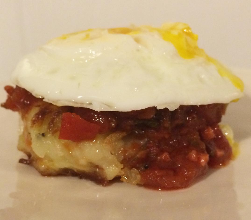 Shakshuka latkes with fried egg