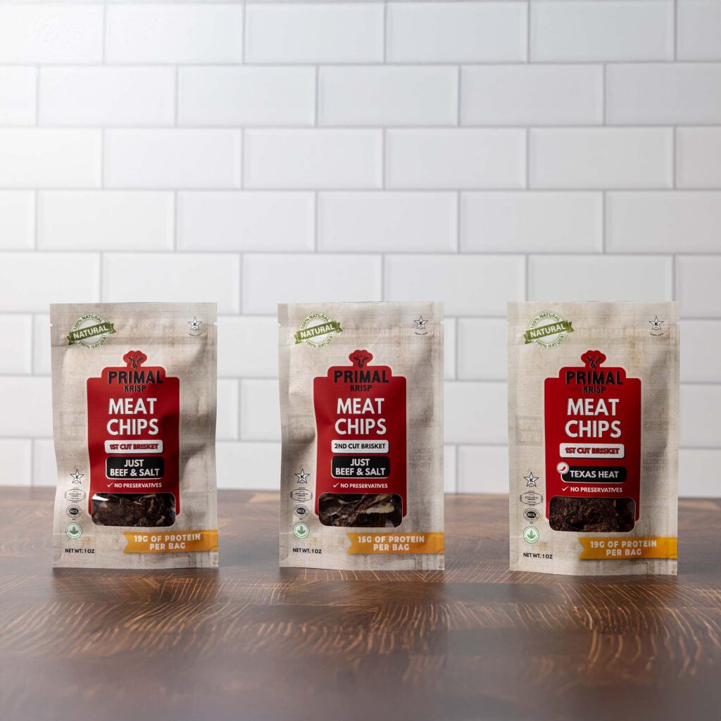 Kosher protein meat chips from Primal Krisp, including chicken and brisket flavors, served as an easy snack for kids