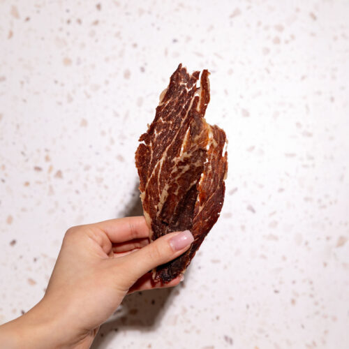 Kosher protein meat chips from Primal Krisp, including chicken and brisket flavors, served as an easy snack for kids